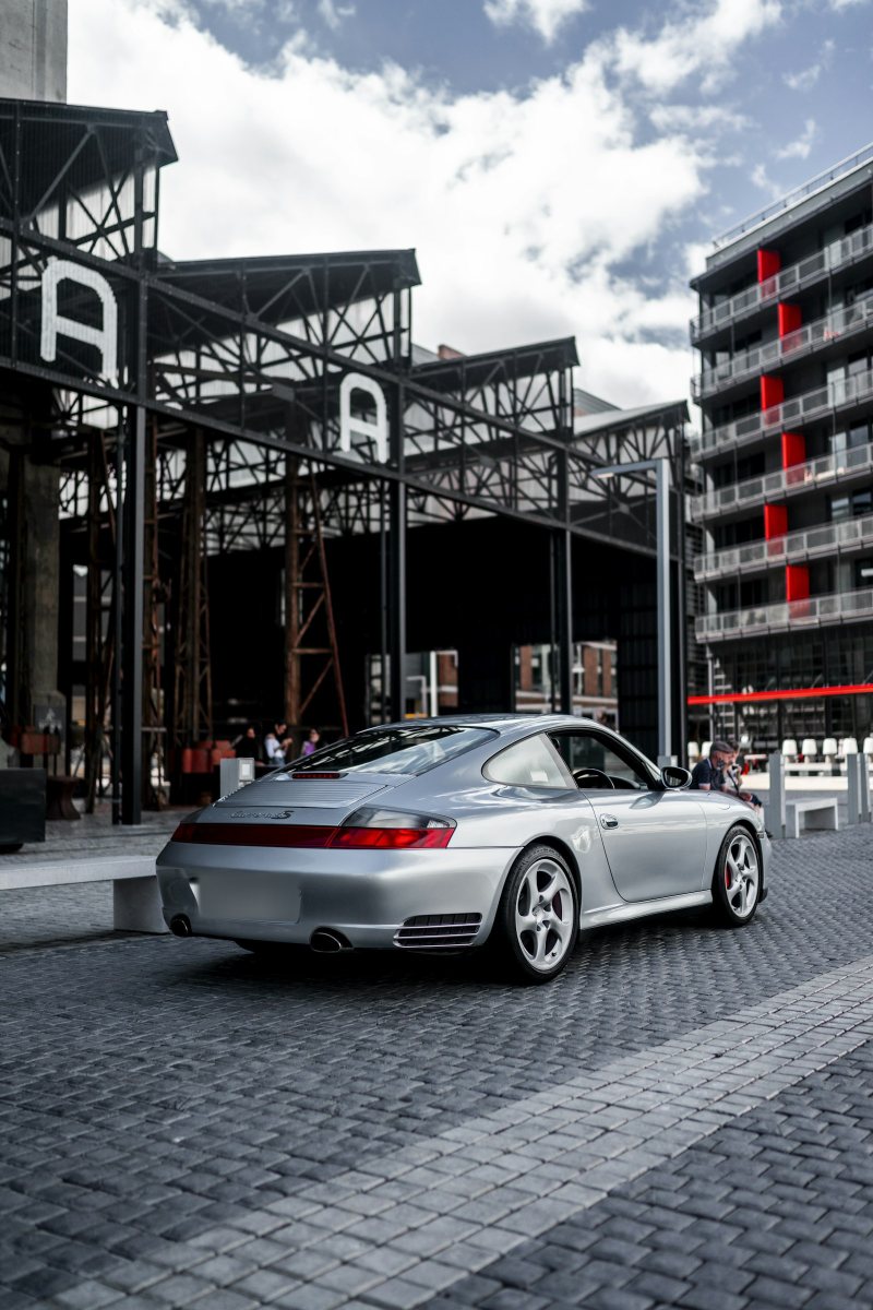 Silver 996 Carrera 4S, rear three-quarter view